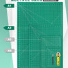 A green cutting mat with multiple sizes A1 through A4 available, showing various grid patterns and tools.