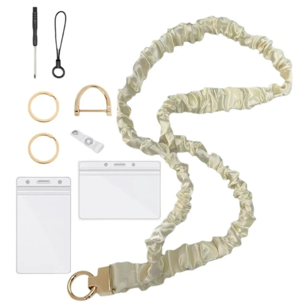A beige stretchy breakaway ID badge lanyard with a retractable reel and a clip.