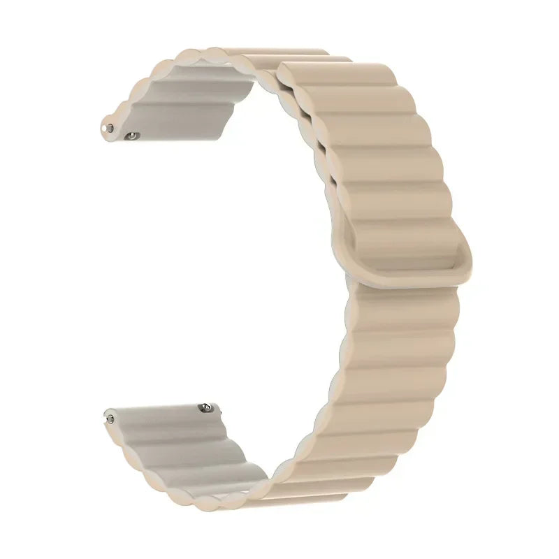 A beige adjustable magnetic loop watch band shown in a curved shape.