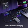 A USB-C PD fast charging setup showing a laptop being charged via a hub connected to a power outlet.
