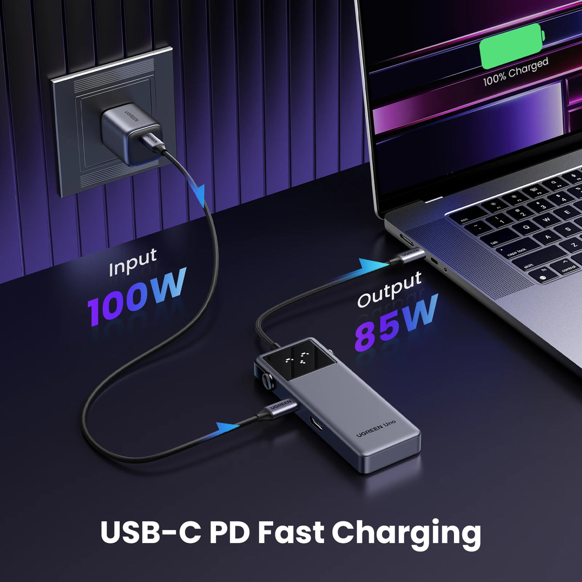 A USB-C PD fast charging setup showing a laptop being charged via a hub connected to a power outlet.