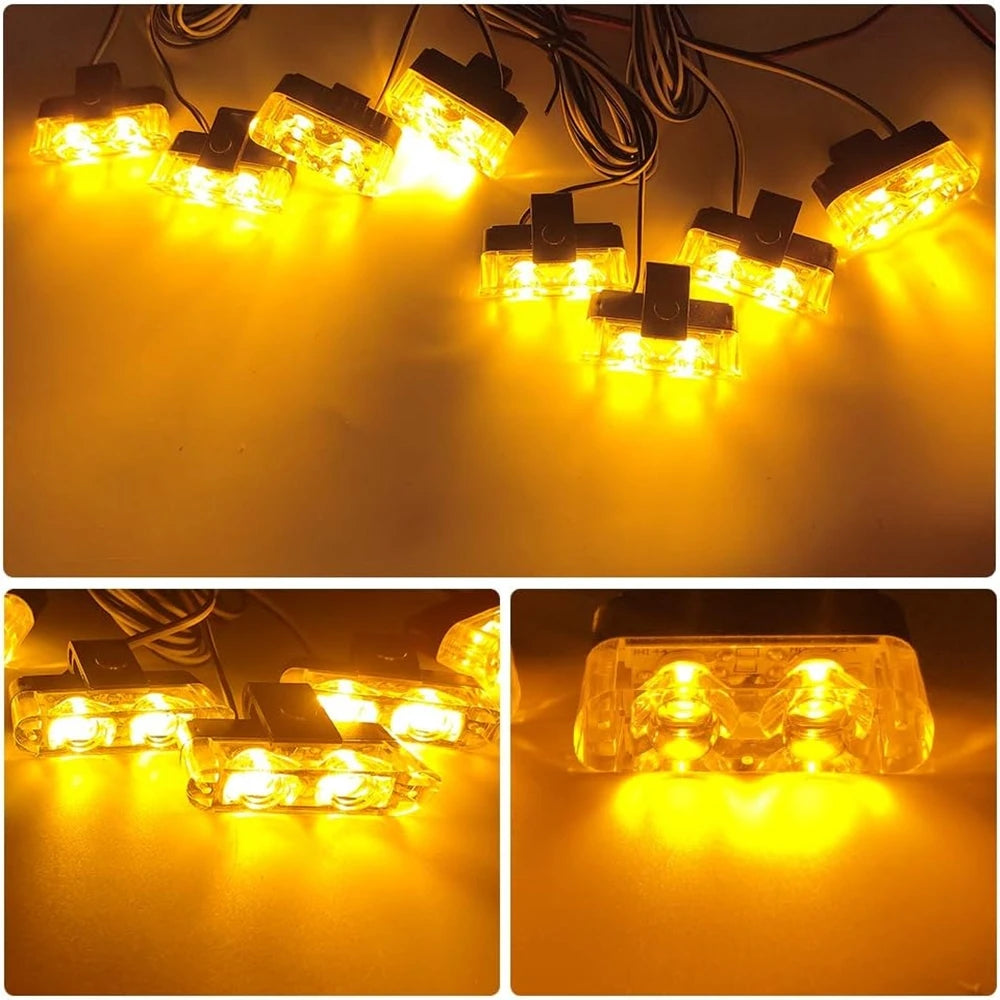 A close-up view of multiple wireless LED emergency strobe lights illuminating a dark surface.