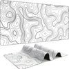 A black and white line drawing of a large contoured rubber mouse pad for gaming and desk use.