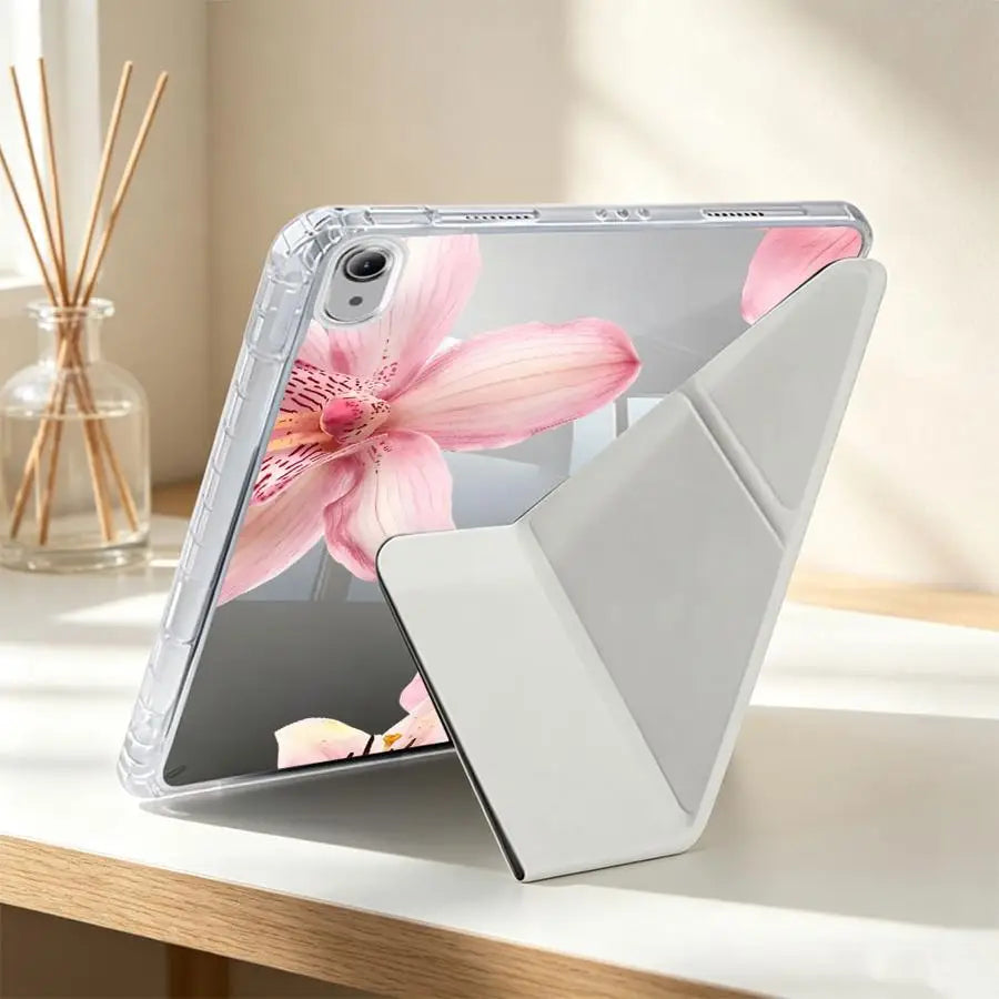 A clear silicone case with a floral design protects an iPad or tablet.