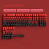 A close-up view of a red mechanical keyboard featuring Cherry profile keycaps with side printing and shine through.