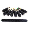 A collection of various laptop charger connector tips and plugs in black and gold colors.