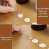 Close-up of double-sided adhesive nano gel material being applied to a wooden surface.