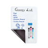 A white magnetic dry erase board with a grocery list written on it, featuring items like eggs, milk, salad, chicken breast, a