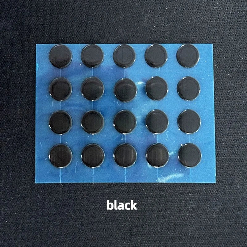 A blue sheet with multiple black adhesive dots, representing PTFE mouse skates for smooth gliding.