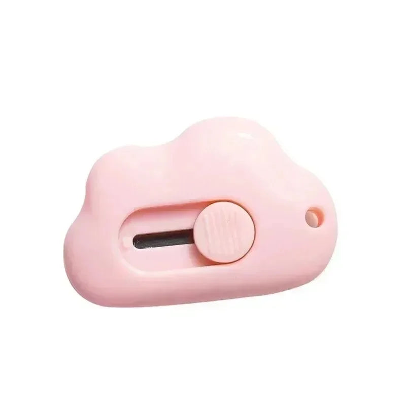 A pink portable rabbit cloud letter opener and crafting tool with a round opening.