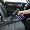 A hand is using a purple high-speed cordless air blower to clean the interior of a car seat.