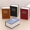 A collection of four hardcover books in brown, black, red, and blue shades displayed on a light surface.