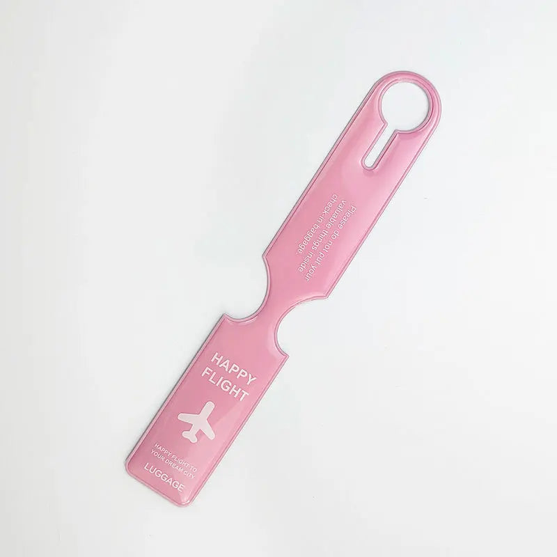 A pink durable PVC luggage tag with a loop handle and the text Happy Flight and Luggage.