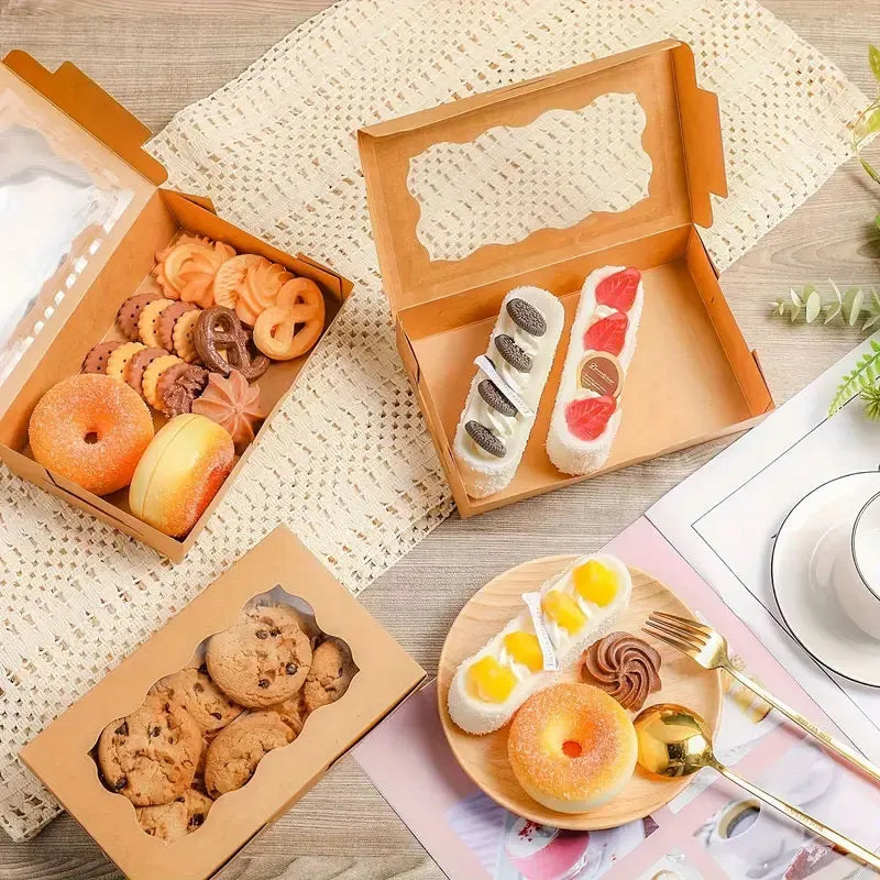 A collection of baked goods including cookies, bread, and candy displayed in kraft paper gift boxes.