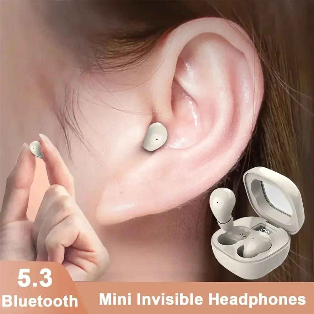 A hand holds a white mini invisible headphone device next to a person's ear, showing the product design.