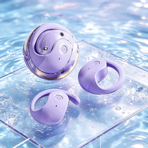 A purple wireless Bluetooth earbud is floating on clear water, surrounded by bubbles.