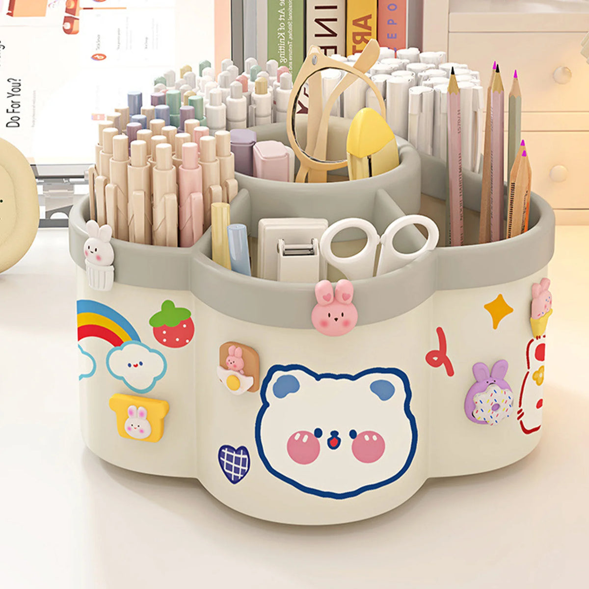 Rotierender Desktop-Stifthalter mit bunten Stiften und Bleistiften in kreisförmiger Anordnung.