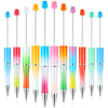 A row of colorful plastic beaded ballpoint pens in various colors like blue, orange, pink, and green.