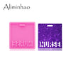 Pink silicone resin mold with a small indentation next to a purple glitter mold shaped like the word NURSE