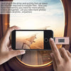 A hand holds a smartphone displaying a scenic view, with a USB flash drive inserted into the device.