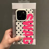 A pink polka dot phone case with the word SWAG printed on it, shown being held by a hand.