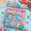 A colorful sticker book featuring 3D elements and a pocket cabin scene kit for DIY crafts.