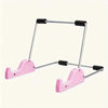 A pink foldable aluminum stand for tablets and laptops with black grips.
