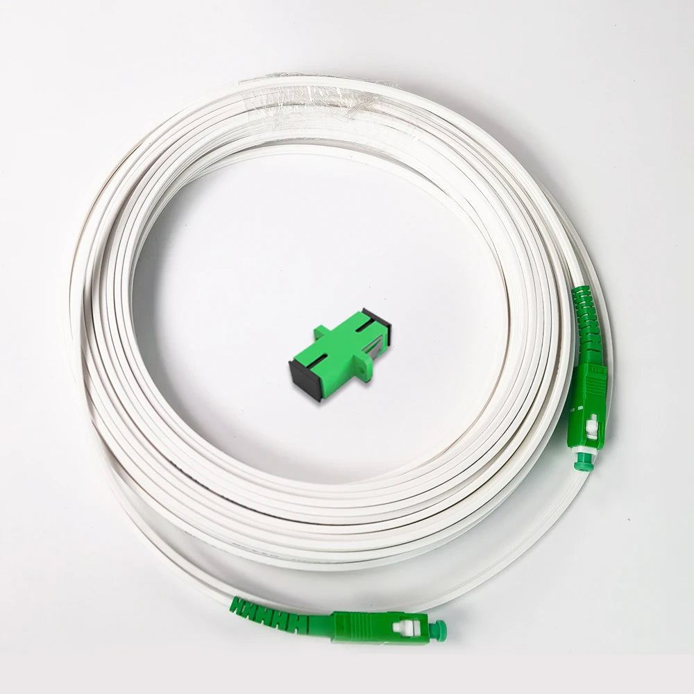 A coil of white single-mode fiber optic cable with green connectors.
