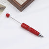 A silver pen accessory with a red rhinestone ball and a sparkly red body is shown on a white background.