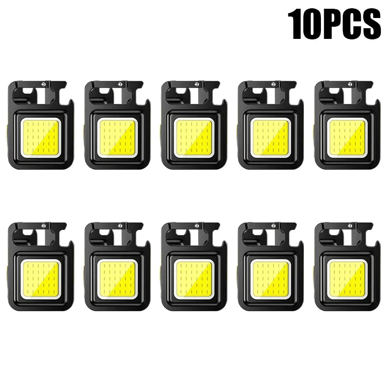 Ten compact COB keychain flashlights with magnetic bases and rechargeable batteries.