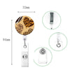 A leopard print retractable badge holder with a gold-toned design and silver clip.