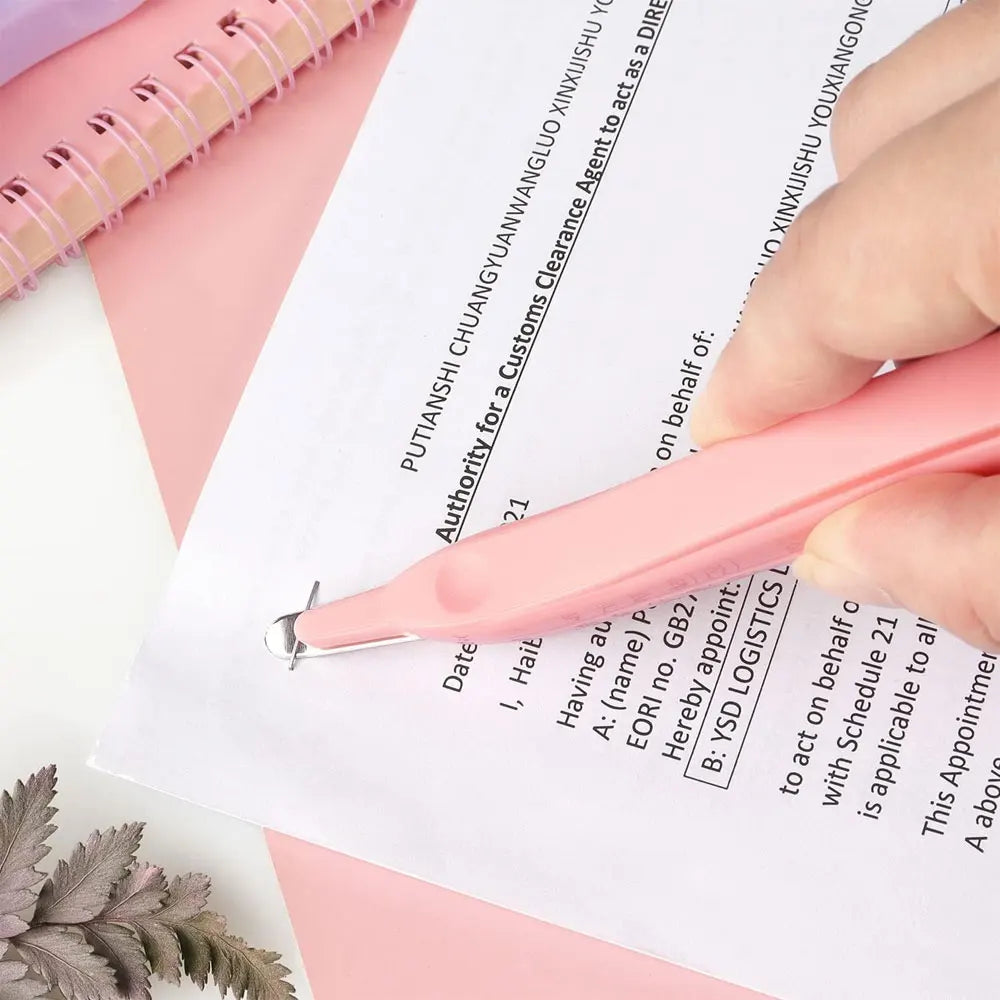 A hand holds a pink pen over a document with text, showing an office tool set.