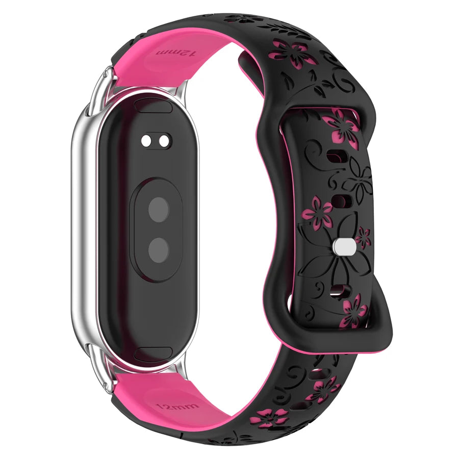 A pink and black silicone watch band with 3D engraved flowers for a Xiaomi smart band.