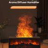 A black flame fireplace aroma diffuser humidifier is displayed on a wooden table, showing bright orange flames.