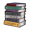 A lapel pin featuring five stacked enamel books with titles like Stont Chamber Prisoner Goblet Order Prince Hallows