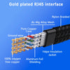Close-up view of a gold-plated RJ45 interface showing the internal structure of an aluminum-manganese alloy mesh and copper c