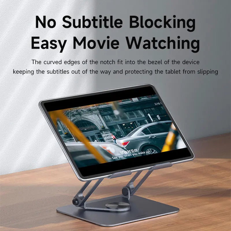 A silver aluminum tablet stand holding a tablet, demonstrating no subtitle blocking easy movie watching.