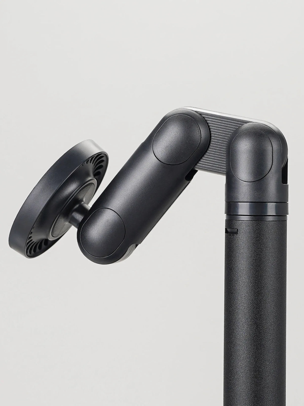 A black 5-axis magnetic phone and tablet stand with an adjustable arm and mounting plate.