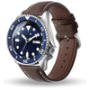 A brown leather watch band with a silver watch face and bezel displaying the time.