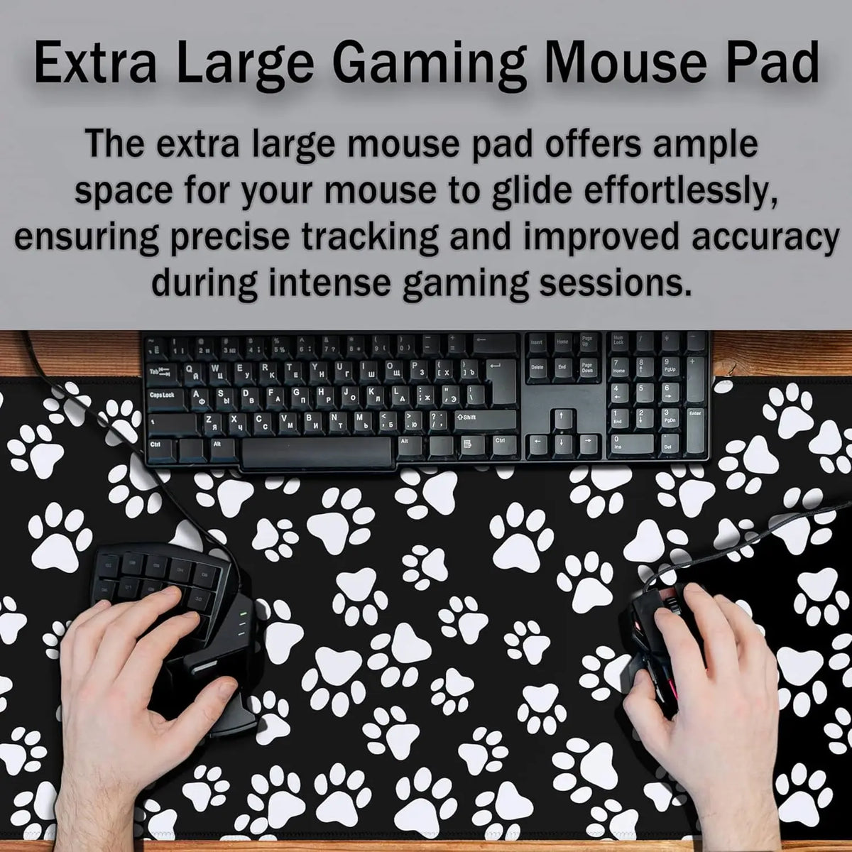 A black gaming mouse is placed on an extra large pet paw print desk mat with white paw prints.