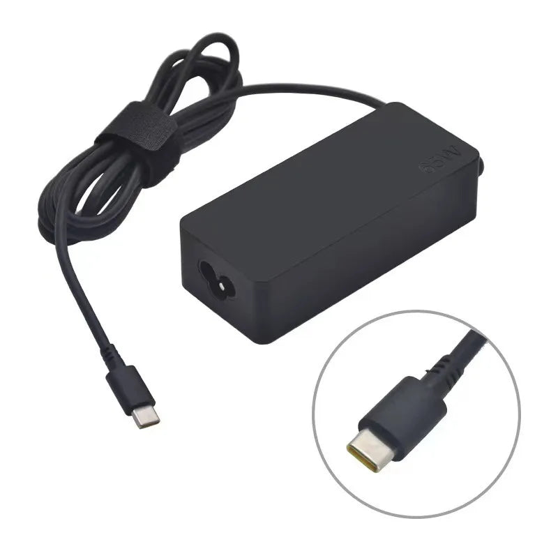 A black universal 65W USB-C AC adapter with a cable and connector tip.