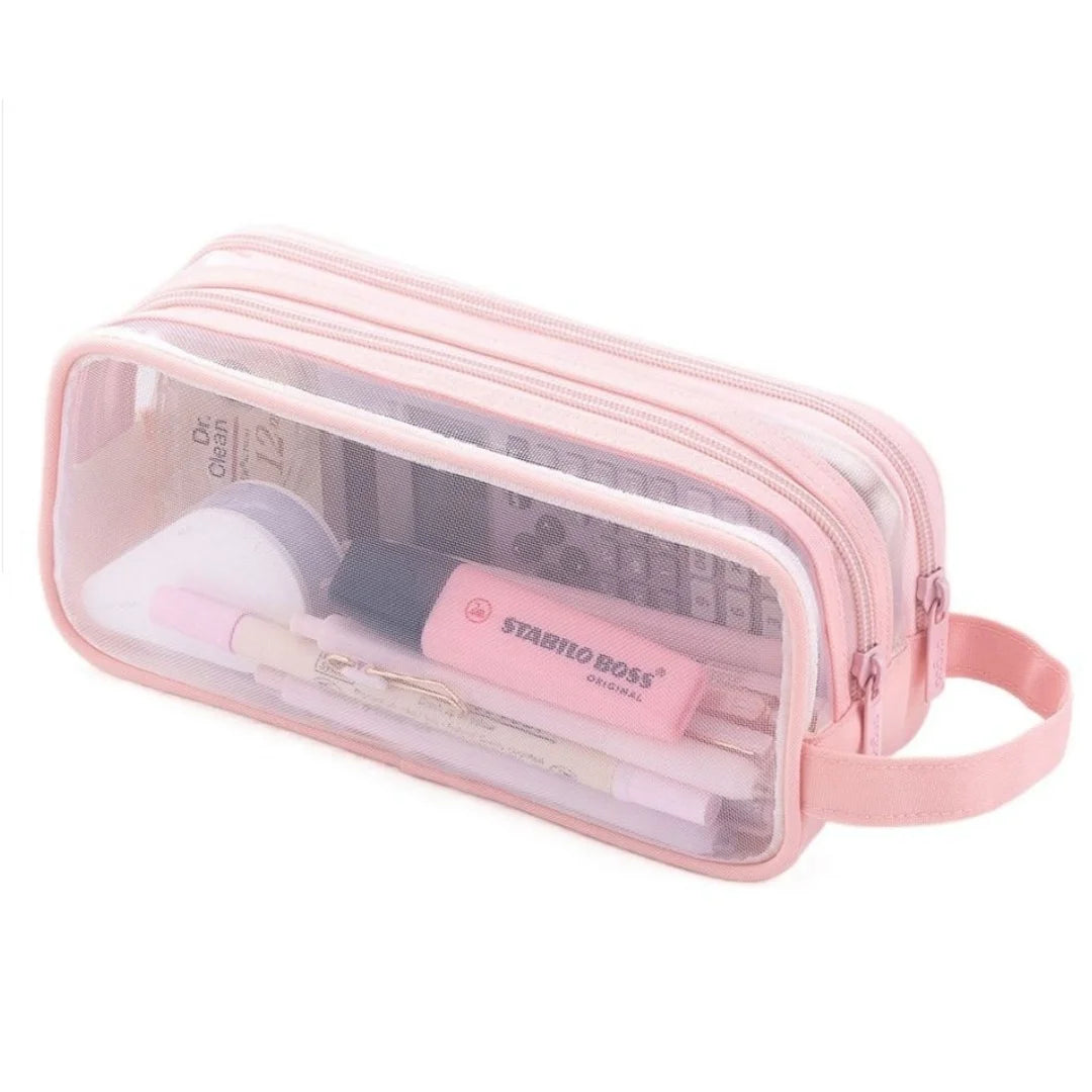 A pink transparent mesh pencil pouch containing cosmetic tools and makeup items.