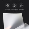 A stack of clear thermal laminating pouches and various plastic film products are displayed on a white surface.