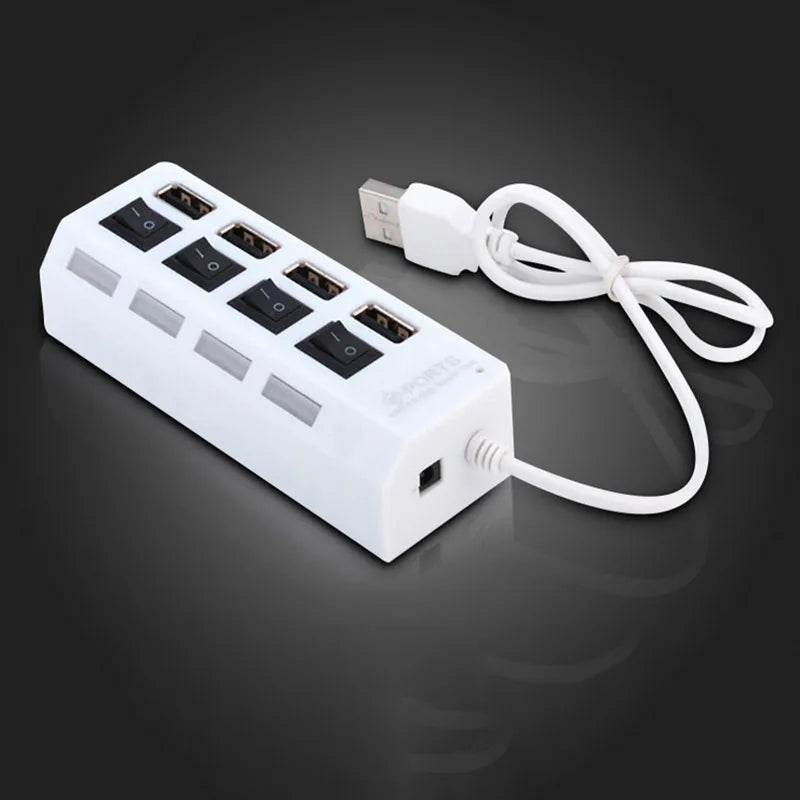 A white USB hub splitter extender with multiple ports and a white cable plugged into a power source.