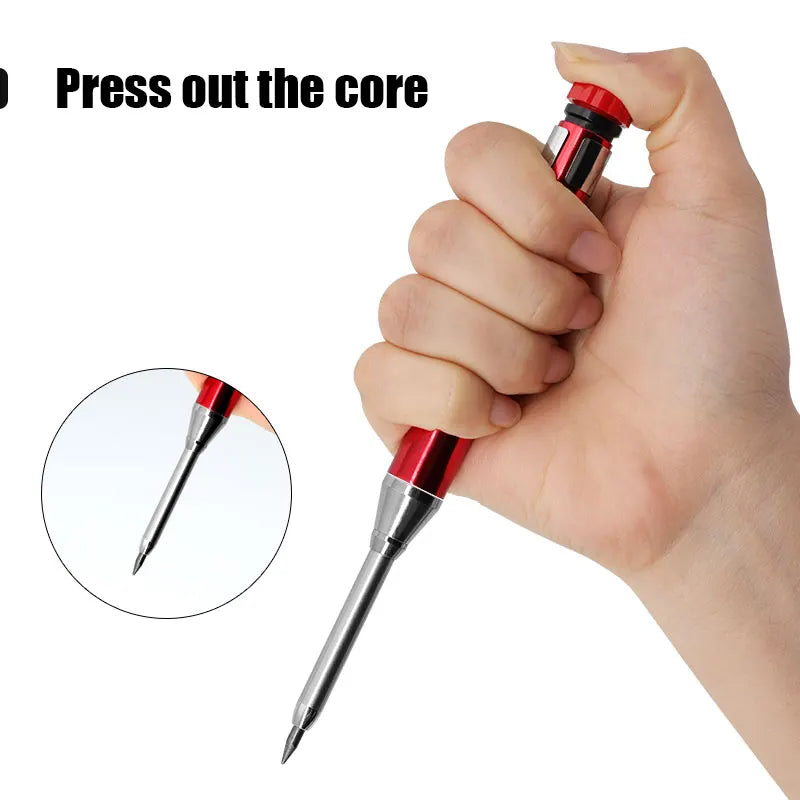 A hand is pressing out the core of a metal carpenter pencil with a built-in sharpener cap.