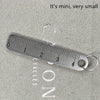 A stainless steel ruler marked in inches is shown next to the word ON, demonstrating its small size.