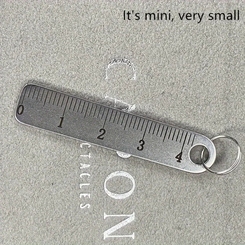 A stainless steel ruler marked in inches is shown next to the word ON, demonstrating its small size.