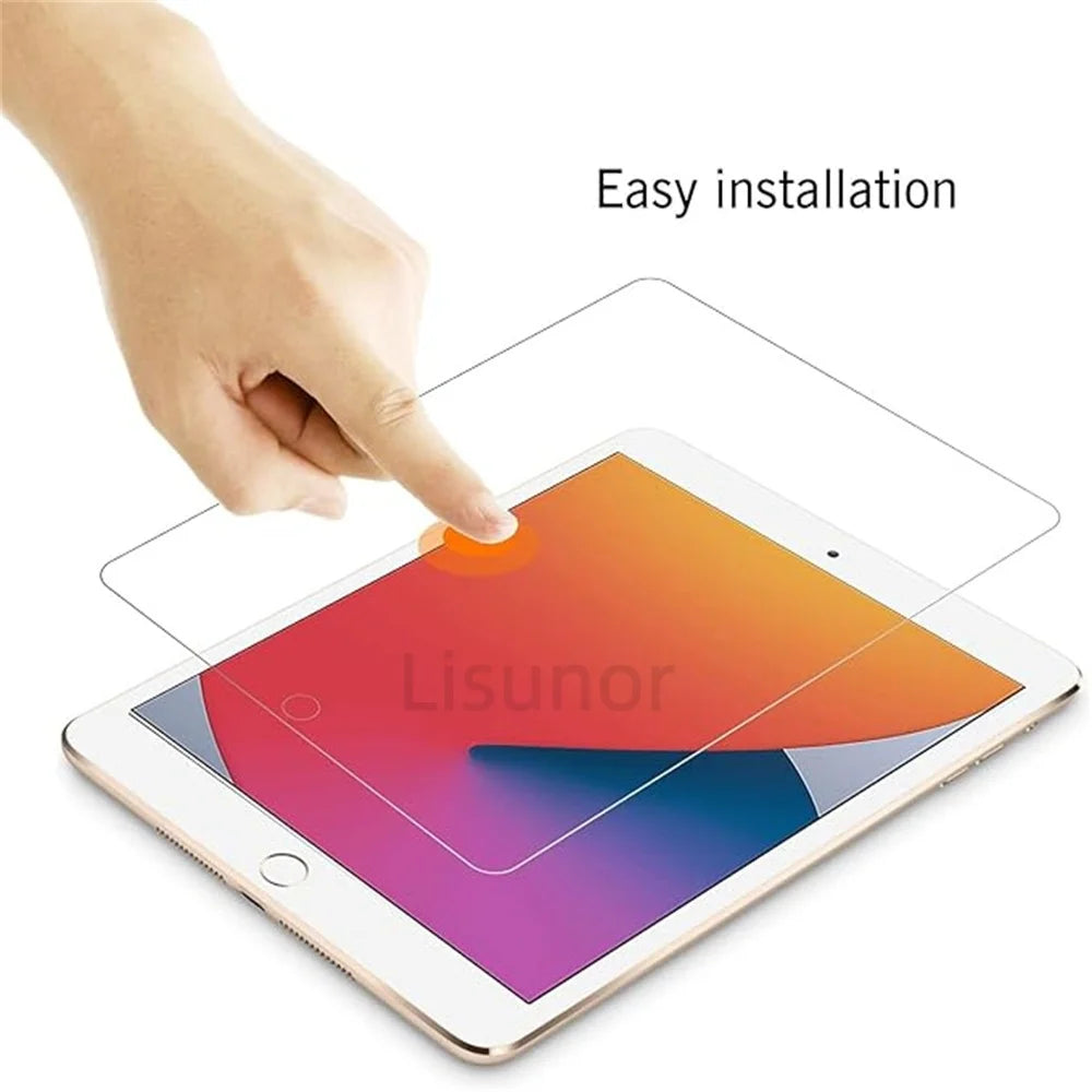A hand is applying a clear tempered glass screen protector to an iPad, demonstrating easy installation.