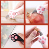 A set of pink and black cat paw retractable utility knives shown in various usage contexts.