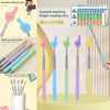 A set of scalable teaching finger reading sticks in various colors and sizes displayed on a light green surface.